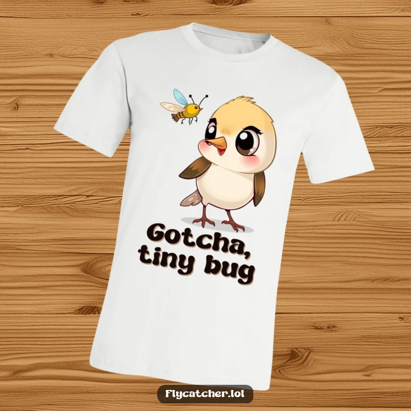 Funny t-shirt featuring a small bird with large eyes making a quick beak snap at a passing insect.